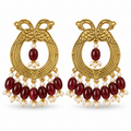 Antique gold peacock chandbali earrings with maroon beads and pearl accents, front view