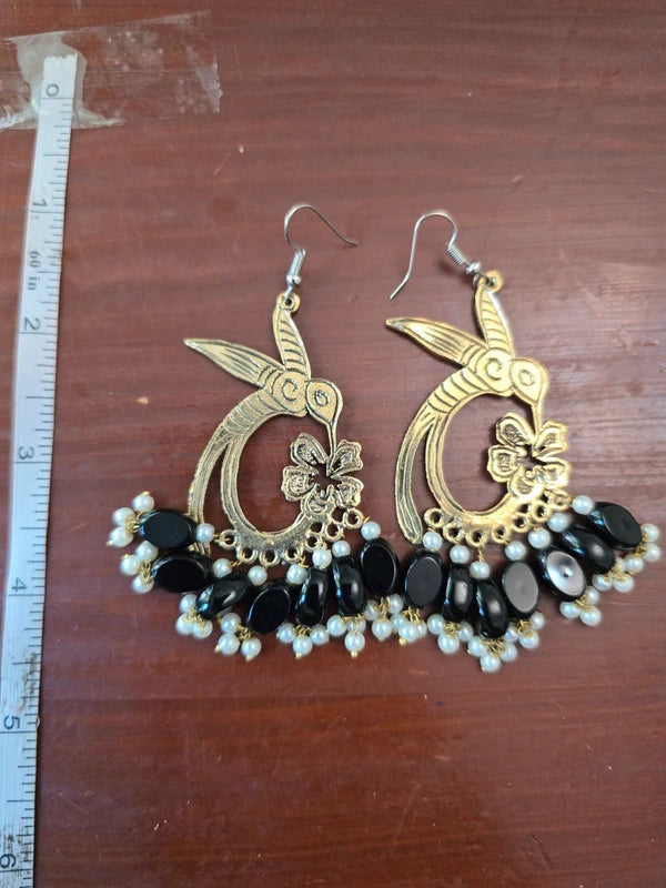 Antique gold tone bird drop earrings with black beads and pearl-style accents