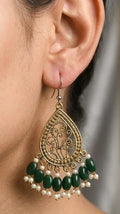 Antique gold tone teardrop earrings with green beads and pearl-style accents