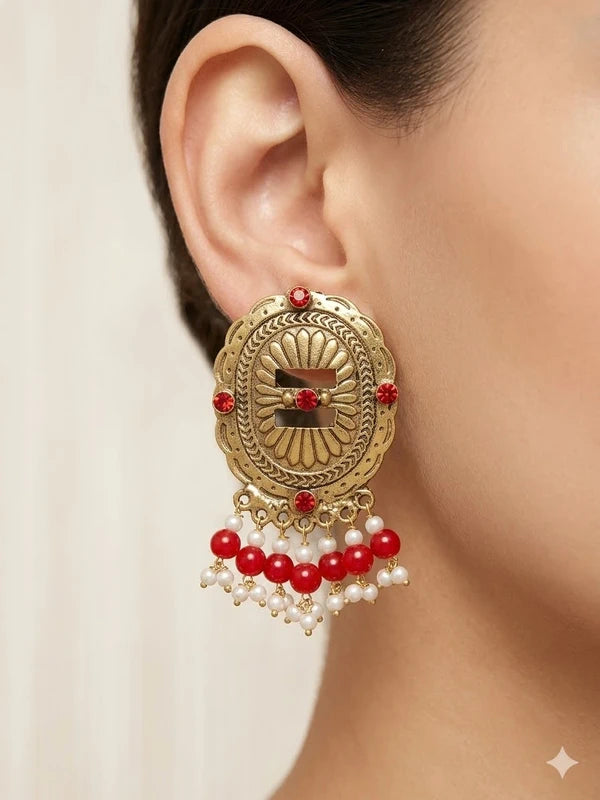 Antique gold tone medallion earrings with red beads and pearl-style drops