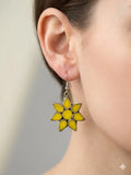 Yellow flower drop earrings with gold tone outline and hook fastening
